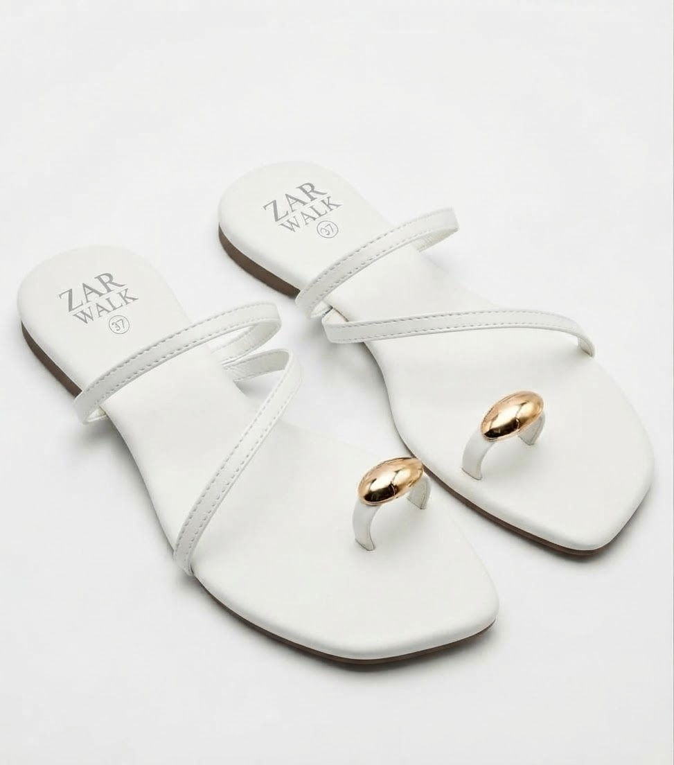 White women’s strappy flat sandals