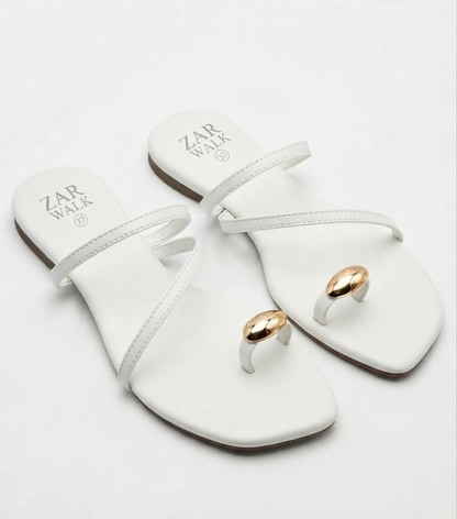 White women’s strappy flat sandals