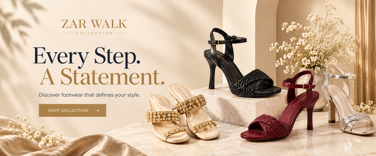 A promotional banner for the Zar Walk Collection showcasing a collection of women's high-heeled sandals. The shoes include black strappy heels, gold embellished peep-toe sandals, a burgundy open-toe stiletto, and silver heels, displayed on marble pedestals with dried flowers and draped satin against a warm beige background with text reading 'Every Step.